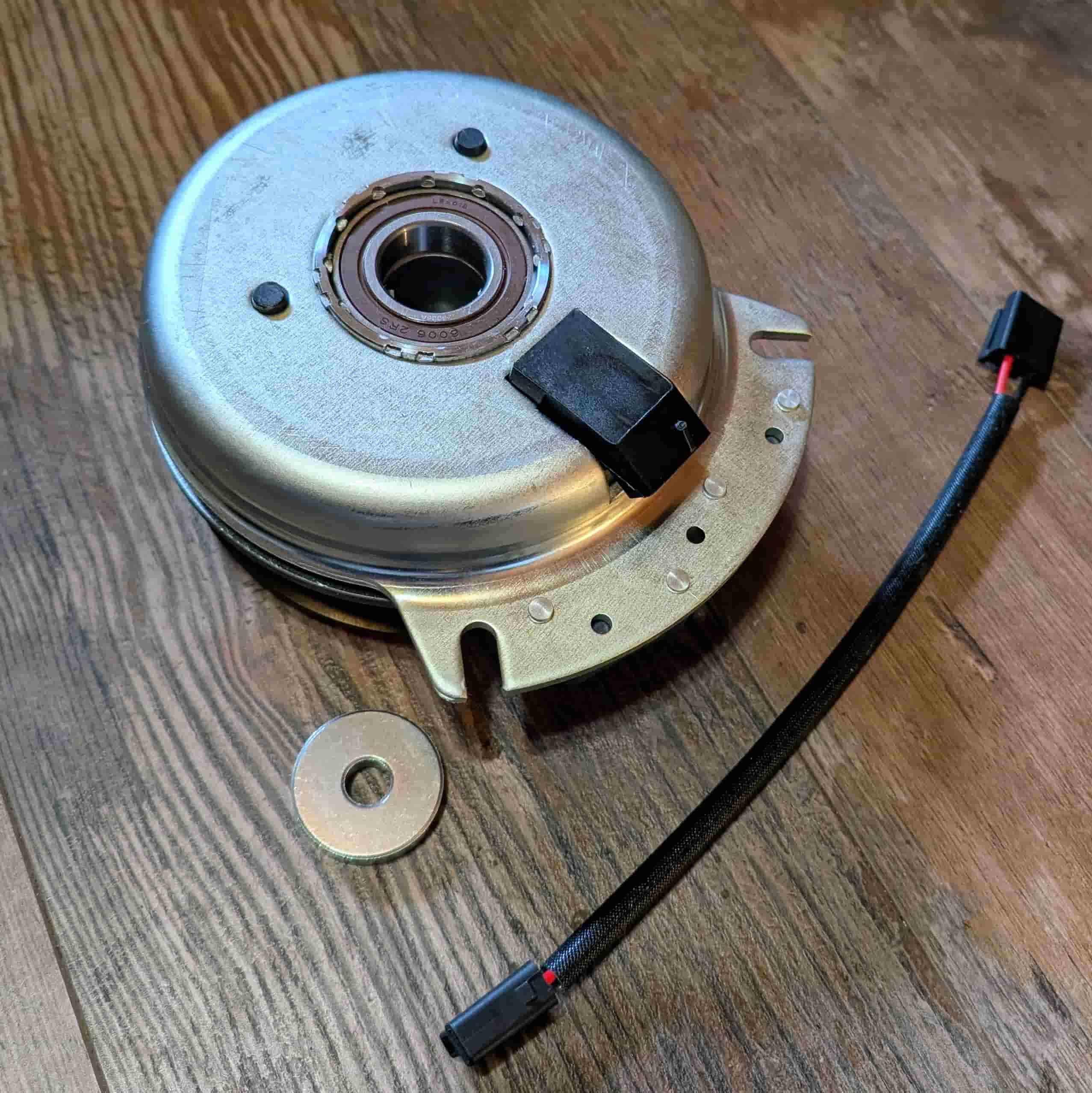 Under side of PTO clutch 2721337 showing metal shell and bearing.