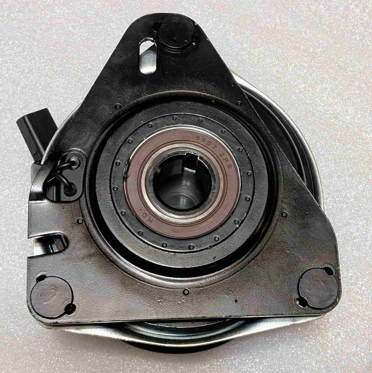 Flip side view of aftermarket PTO clutch replacement for John Deere AM130328 showing mounting plate, keyed bore and anti-rotation geometry 