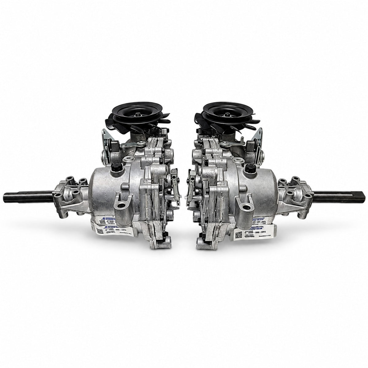 Hydro-Gear EZT left ZC-DNBB-3D8C-2WPX and right ZC-ANBB-3D8B-2WPX transaxles shown together with outward-facing axles and black pulleys