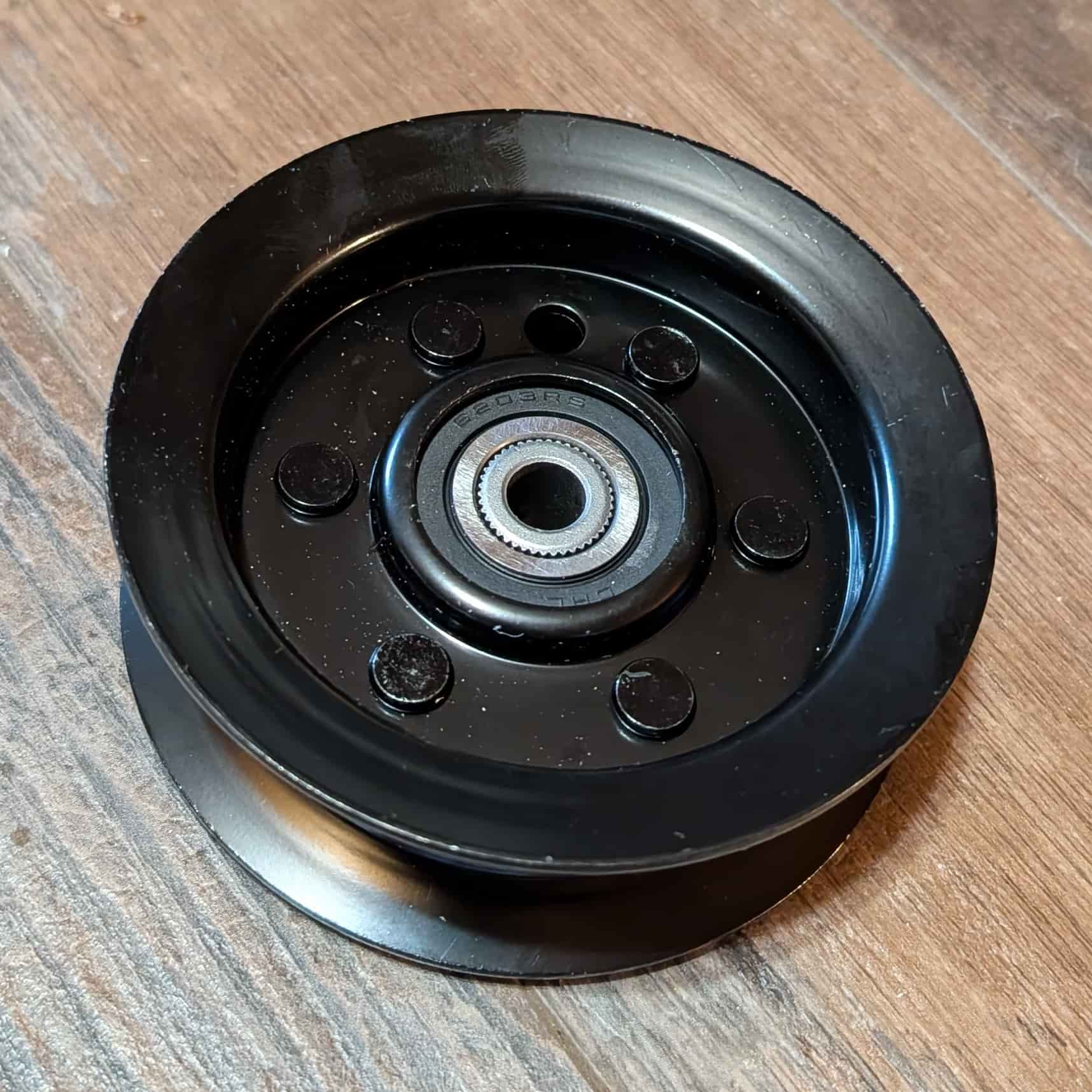 Close up of idler pulley 106-2175 as part of full deck rebuild kit for Toro Timecutter.