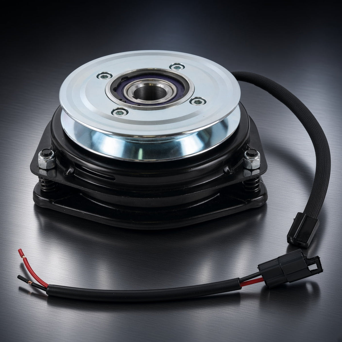 Angled view of Xtreme X0652 PTO clutch for Ogura MA-GT3-MC01 with silver pulley, wiring lead and separate connector pigtail