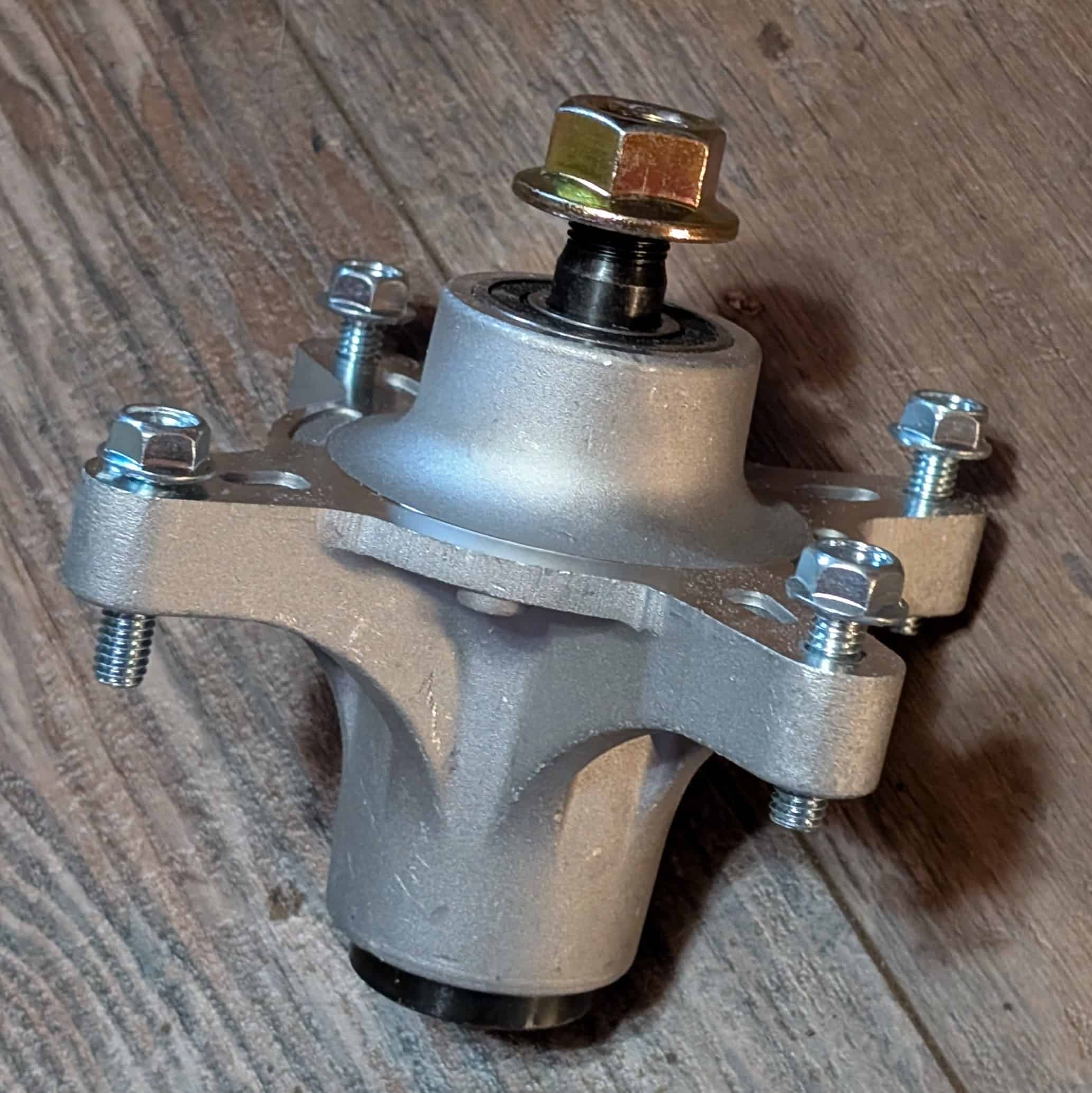 Close up of spindle assembly 117-7268 part of deck kit for Toro Timecutter.